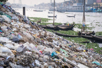 garbage and plastic pollution on the river bank in Dhaka, Bangladesh ...